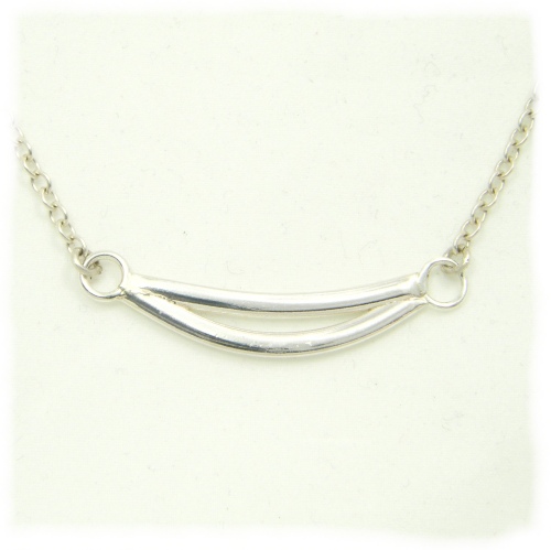 Thicker smile silver pendant